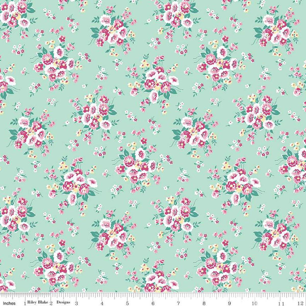 Image of the Precious Petites Main Mint quilting cotton fabric by Gerri Robinson for Riley Blake Designs. Features flowers on a green background. Cute Little Fabric Shop