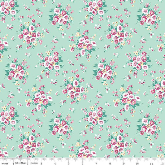 Image of the Precious Petites Main Mint quilting cotton fabric by Gerri Robinson for Riley Blake Designs. Features flowers on a green background. Cute Little Fabric Shop