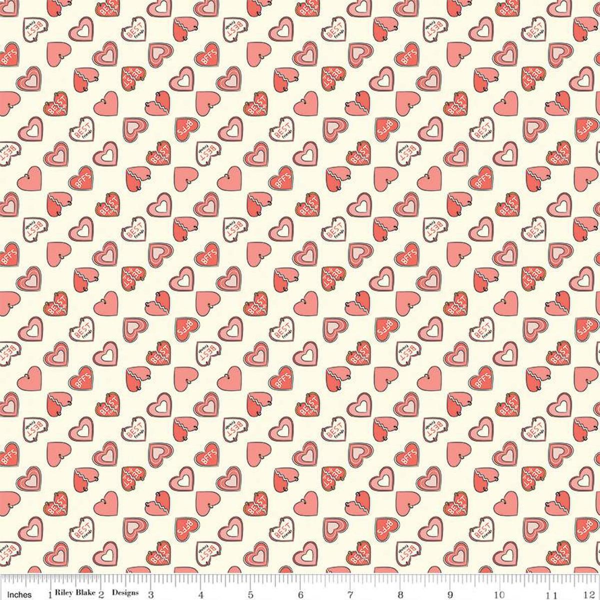 Image of the Besties Charms Vanilla quilting cotton fabric by Corinne Wells for Riley Blake Designs. Features hearts on a cream background. Cute Little Fabric Shop