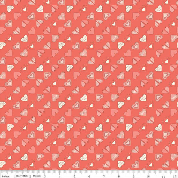 Image of the Besties Charms Lipstick quilting cotton fabric by Corinne Wells for Riley Blake Designs. Features hearts on a coral background. Cute Little Fabric Shop