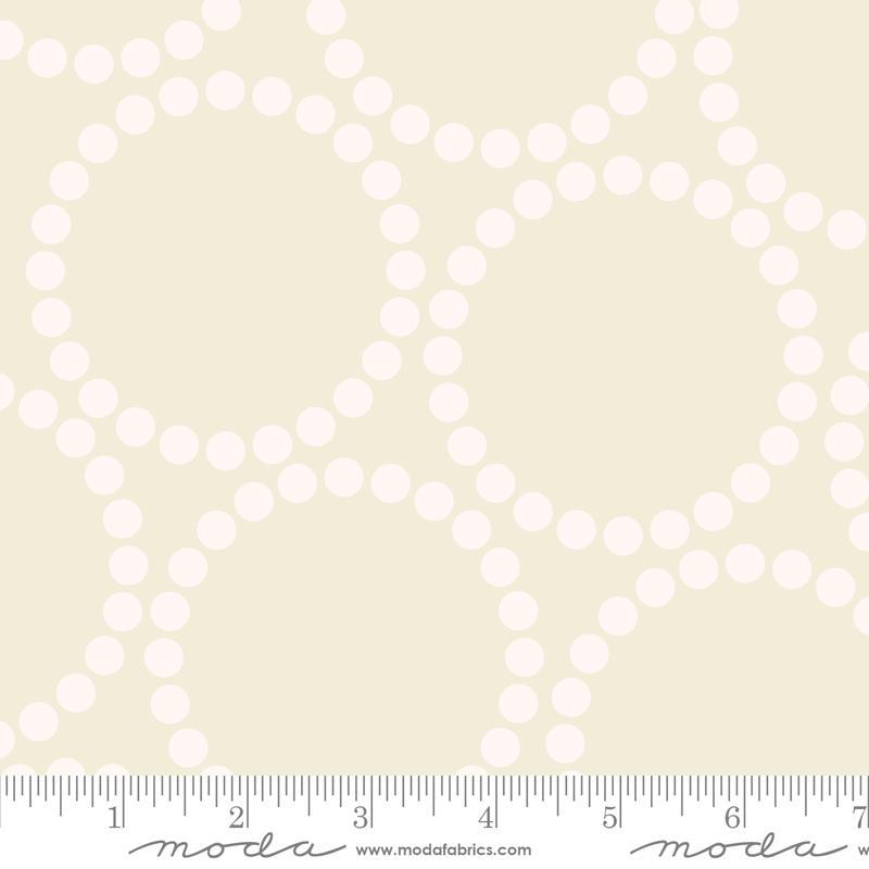 Image of the Pearl Bracelet Eggshell White quilting cotton fabric by Lizzy House for Moda Fabrics. Features circles made up of small dots on a cream background. 
Cute Little Fabric Shop