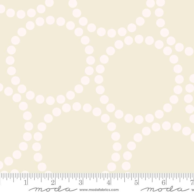 Image of the Pearl Bracelet Eggshell White quilting cotton fabric by Lizzy House for Moda Fabrics. Features circles made up of small dots on a cream background. 
Cute Little Fabric Shop