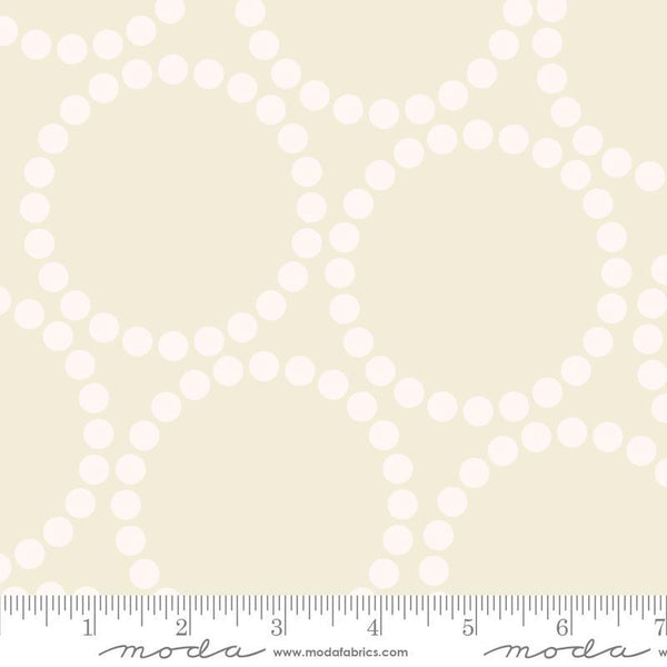 Image of the Pearl Bracelet Eggshell White quilting cotton fabric by Lizzy House for Moda Fabrics. Features circles made up of small dots on a cream background. 
Cute Little Fabric Shop