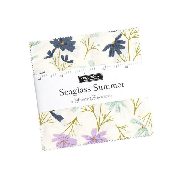 Image of the Seaglass Summer charm pack by Sweetfire Road for Moda Fabrics. Features floral and beach themed fabrics. 
Cute Little Fabric Shop