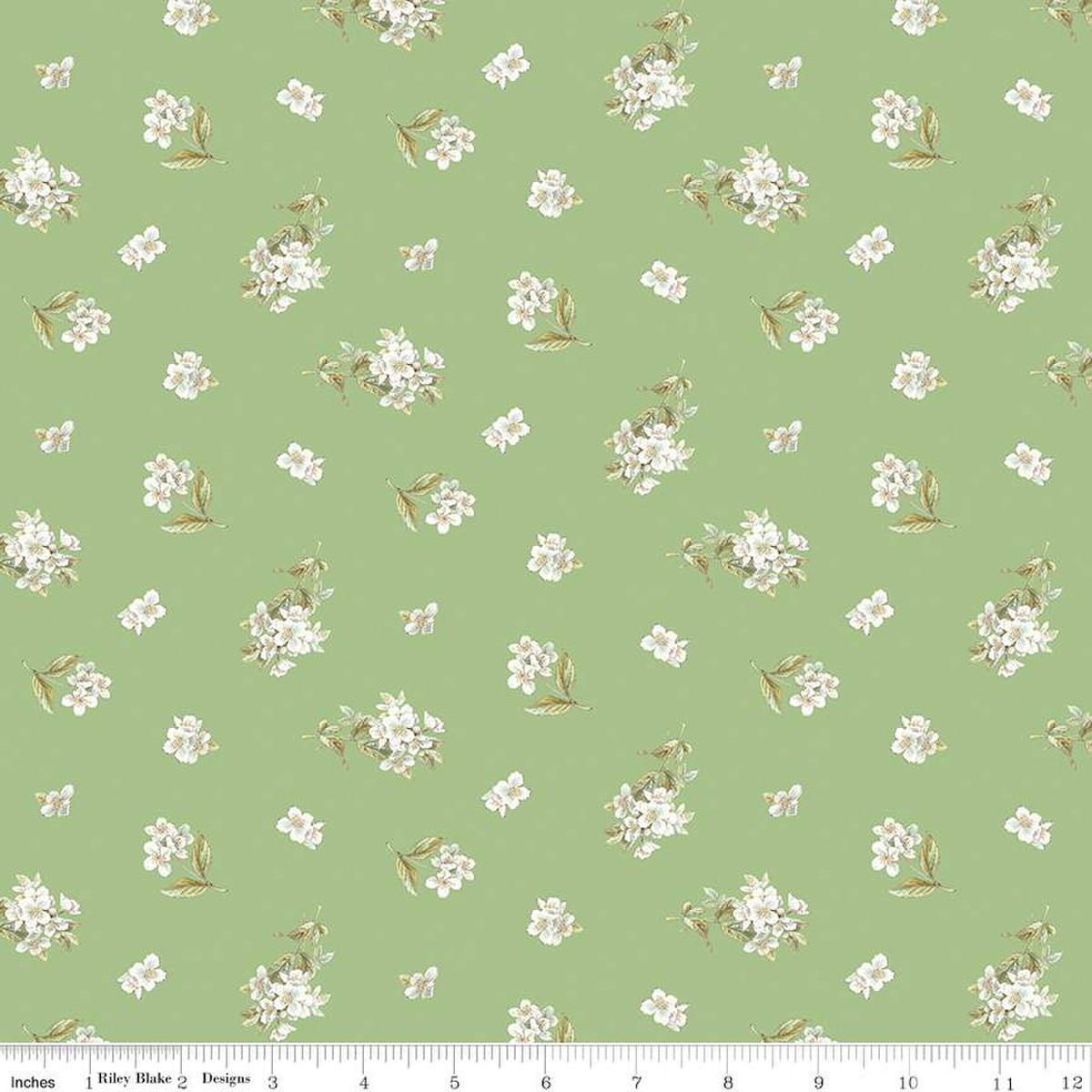 Image of the Peter Rabbit and Friends Jasmine Green quilting cotton fabric by Beatrix Potter for Riley Blake Designs. Features sprigs of flowers on a green background. Cute Little Fabric Shop