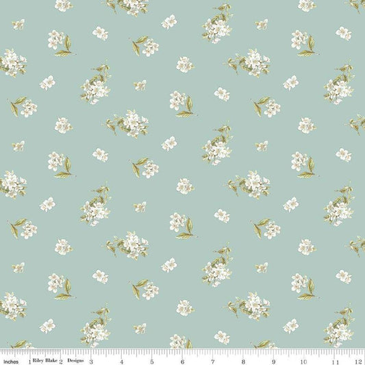 Image of the Peter Rabbit and Friends Jasmine Blue quilting cotton fabric by Beatrix Potter for Riley Blake Designs. Features sprigs of flowers on a blue background. Cute Little Fabric Shop