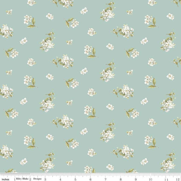 Image of the Peter Rabbit and Friends Jasmine Blue quilting cotton fabric by Beatrix Potter for Riley Blake Designs. Features sprigs of flowers on a blue background. Cute Little Fabric Shop