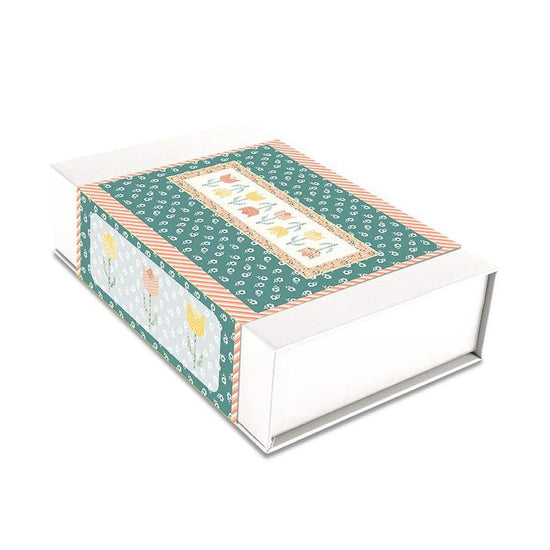 Image of the Tulip Festival Runner Boxed Kit by Sandy Gervais for Riley Blake Designs. Features flowers on a runner quilt. 
Cute Little Fabric Shop