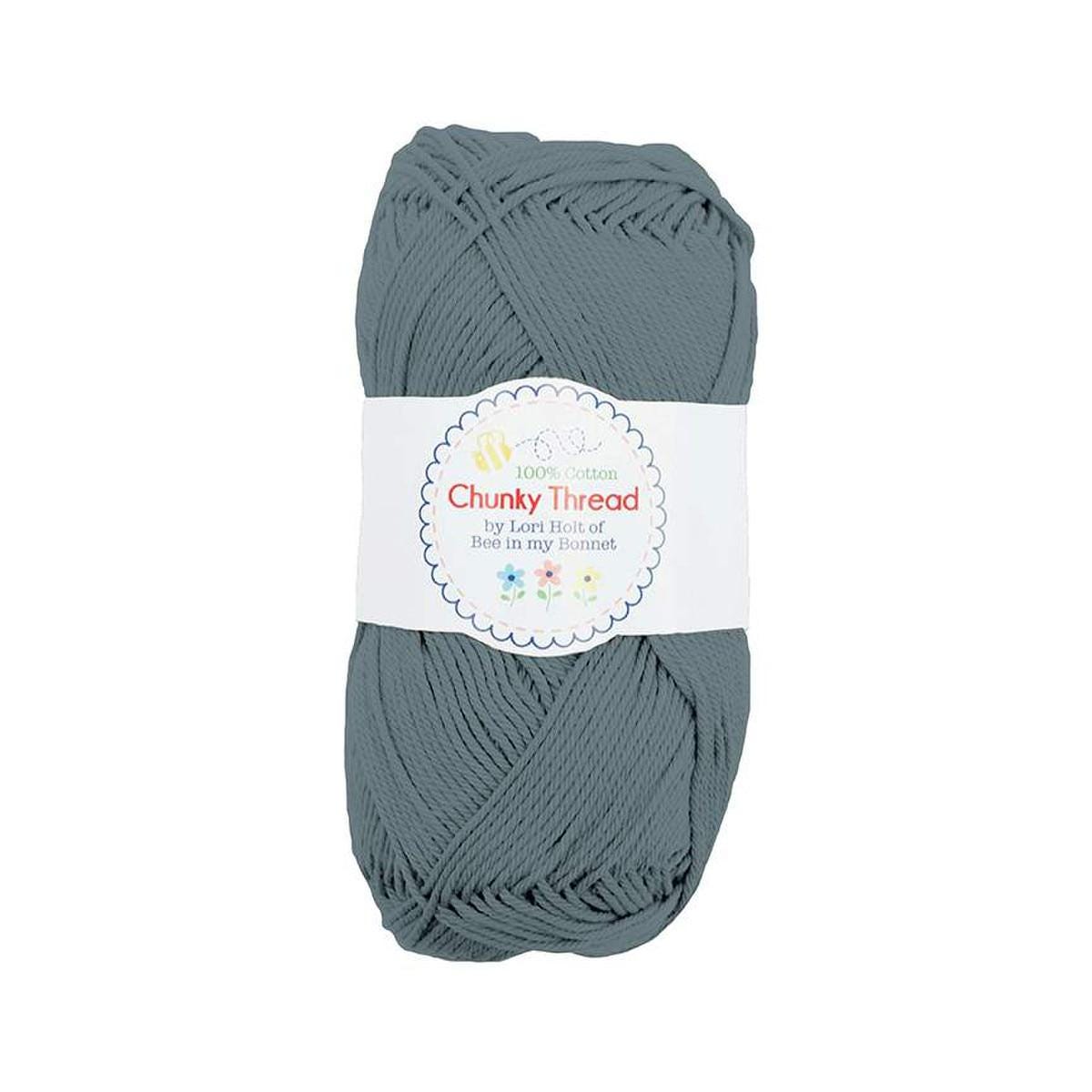 Image of the Chunky Thread Stonewash sport weight thread by Lori Holt for Riley Blake Designs. Features a muted blue thread. 
Cute Little Fabric Shop