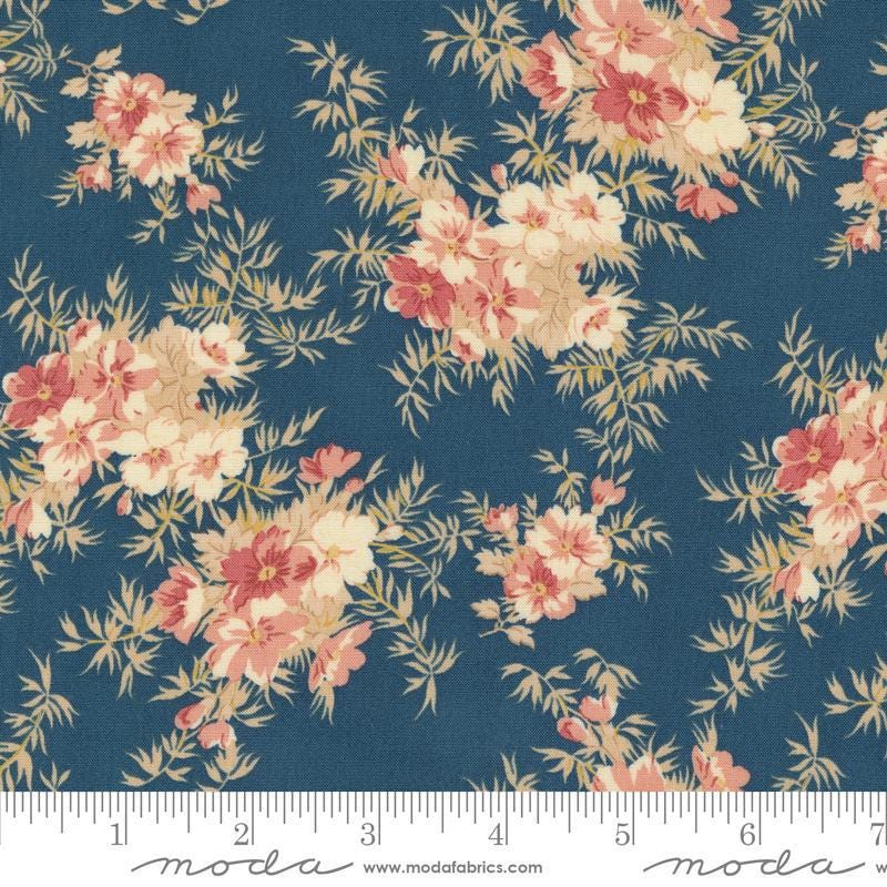 Image of the Sandalwood Cassandra Indigo quilting cotton fabric by 3 Sisters for Moda Fabrics. Features a floral fabric on a blue background. Cute Little Fabric Shop