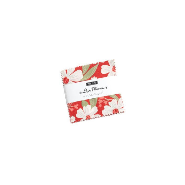 Image of the Love Blooms mini stacker by Moda Fabrics. Features valentine&#39;s day fabrics on various backgrounds. 
Cute Little Fabric Shop