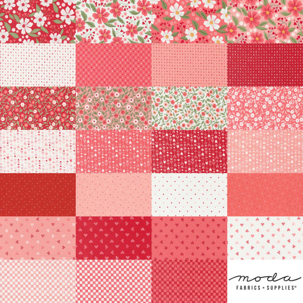 Image of the Love Blooms mini stacker by Moda Fabrics. Features valentine&#39;s day fabrics on various backgrounds. 
Cute Little Fabric Shop