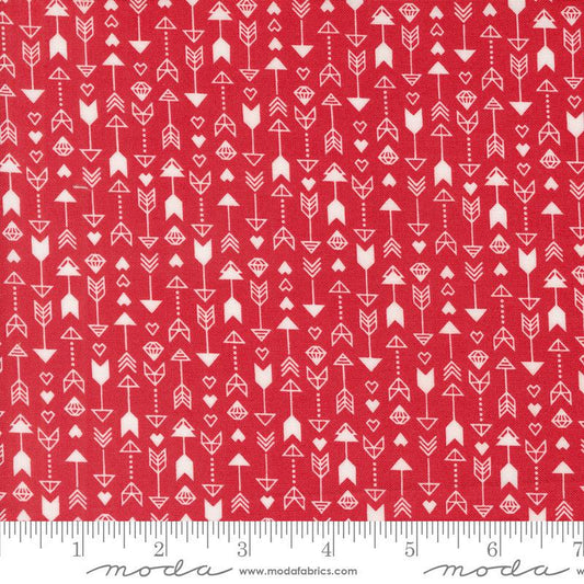 Image of the Love Blooms Arrow Rose quilting cotton fabric by Moda Fabrics. Features arrows on a red background. Cute Little Fabric Shop