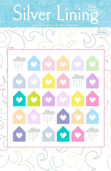 Image of the Silver Lining quilt pattern by Wendy Sheppard for Riley B;ake Designs. Features houses and hearts on a quilt. 
Cute Little Fabric Shop