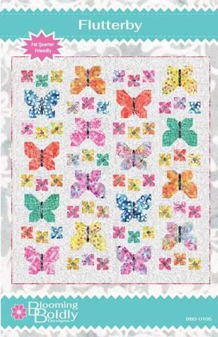 Image of the Flutterby Quilt Pattern by Blooming Boldly Designs for RIley Blake Designs. Features butterflies on a quilt. 
Cute Little Fabric Shop