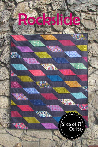 Image of the Rockslide quilt pattern by Slice of Pi Quilts by Riley Blake Designs. Features diamond shapes on a quilt. 
Cute Little Fabric Shop