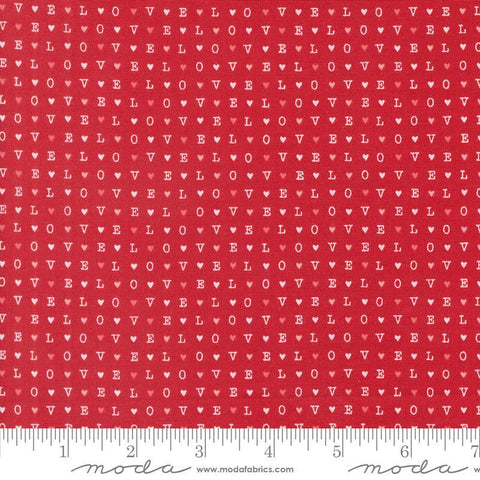 Image of the Love Blooms LOVE Rose quilting cotton fabric by Moda Fabrics. Features the word LOVE on a red background. Cute Little Fabric Shop