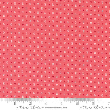 Image of the Love Blooms LOVE Lipstick quilting cotton fabric by Moda Fabrics. Features the word LOVE on a pink background. Cute Little Fabric Shop