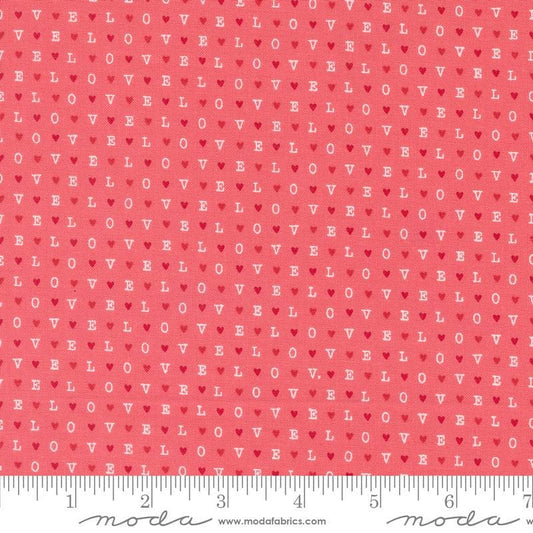 Image of the Love Blooms LOVE Lipstick quilting cotton fabric by Moda Fabrics. Features the word LOVE on a pink background. Cute Little Fabric Shop