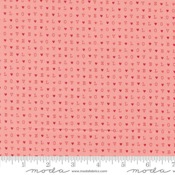 Image of the Love Blooms LOVE Blush quilting cotton fabric by Moda Fabrics. Features the word LOVE on a pink background. Cute Little Fabric Shop