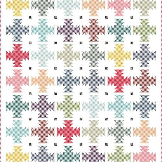 Image of the Prairie Blossom quilt pattern by Wendy Sheppard for Riley Blake Designs. Features star patterns on a quilt. 
Cute Little Fabric Shop