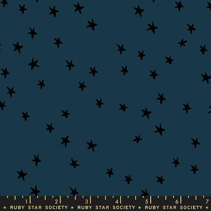 Image of the Starry Blenders Star Smoke quilting cotton fabric by Alexia Abegg for Moda Fabrics. Features small scattered stars on a blue background. Cute Little Fabric Shop