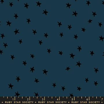 Image of the Starry Blenders Star Smoke quilting cotton fabric by Alexia Abegg for Moda Fabrics. Features small scattered stars on a blue background. Cute Little Fabric Shop