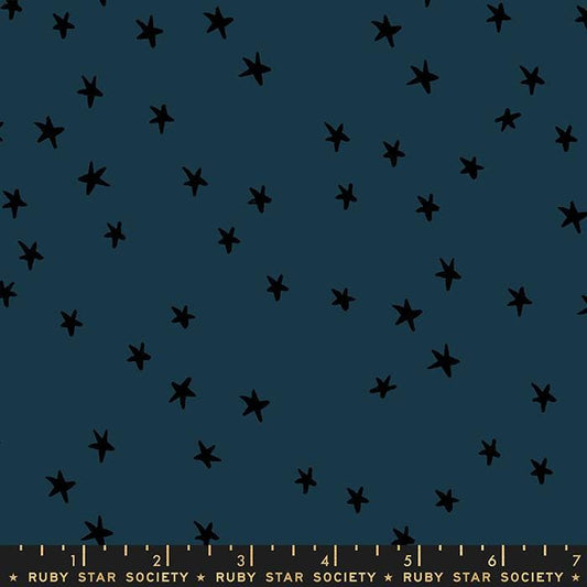 Image of the Starry Blenders Star Smoke quilting cotton fabric by Alexia Abegg for Moda Fabrics. Features small scattered stars on a blue background. Cute Little Fabric Shop