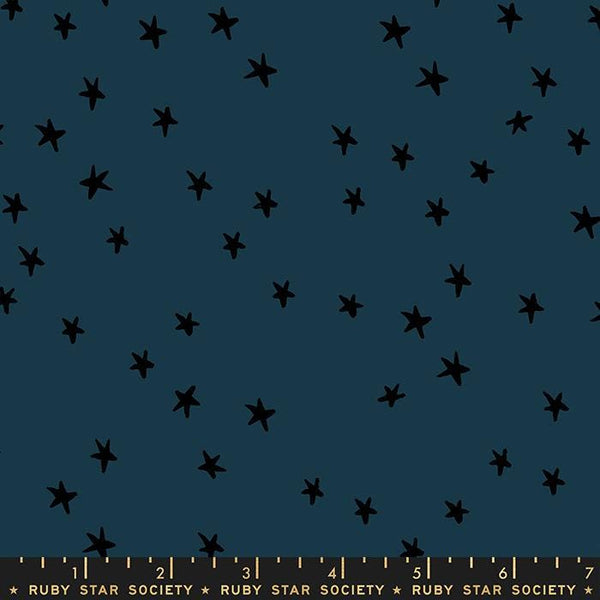 Image of the Starry Blenders Star Smoke quilting cotton fabric by Alexia Abegg for Moda Fabrics. Features small scattered stars on a blue background. Cute Little Fabric Shop