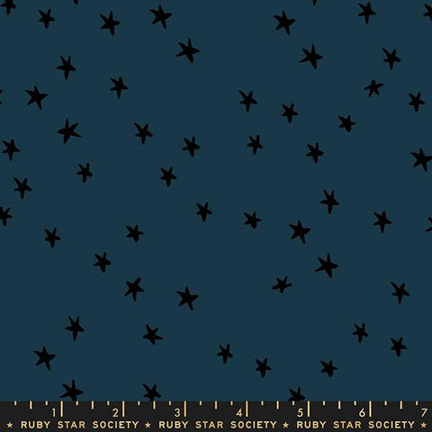 Image of the Starry Blenders Star Smoke quilting cotton fabric by Alexia Abegg for Moda Fabrics. Features small scattered stars on a blue background. Cute Little Fabric Shop