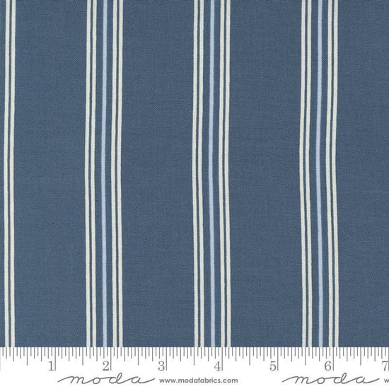 Image of the Seaglass Summer Stripes Indigo Sea quilting cotton fabric by Moda Fabrics. Features stripes on a blue background. Cute Little Fabric Shop