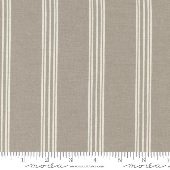 Image of the Seaglass Summer Stripes Sandstone quilting cotton fabric by Moda Fabrics. Features stripes on a tan background. Cute Little Fabric Shop