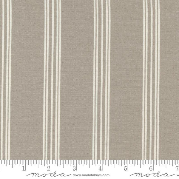 Image of the Seaglass Summer Stripes Sandstone quilting cotton fabric by Moda Fabrics. Features stripes on a tan background. Cute Little Fabric Shop