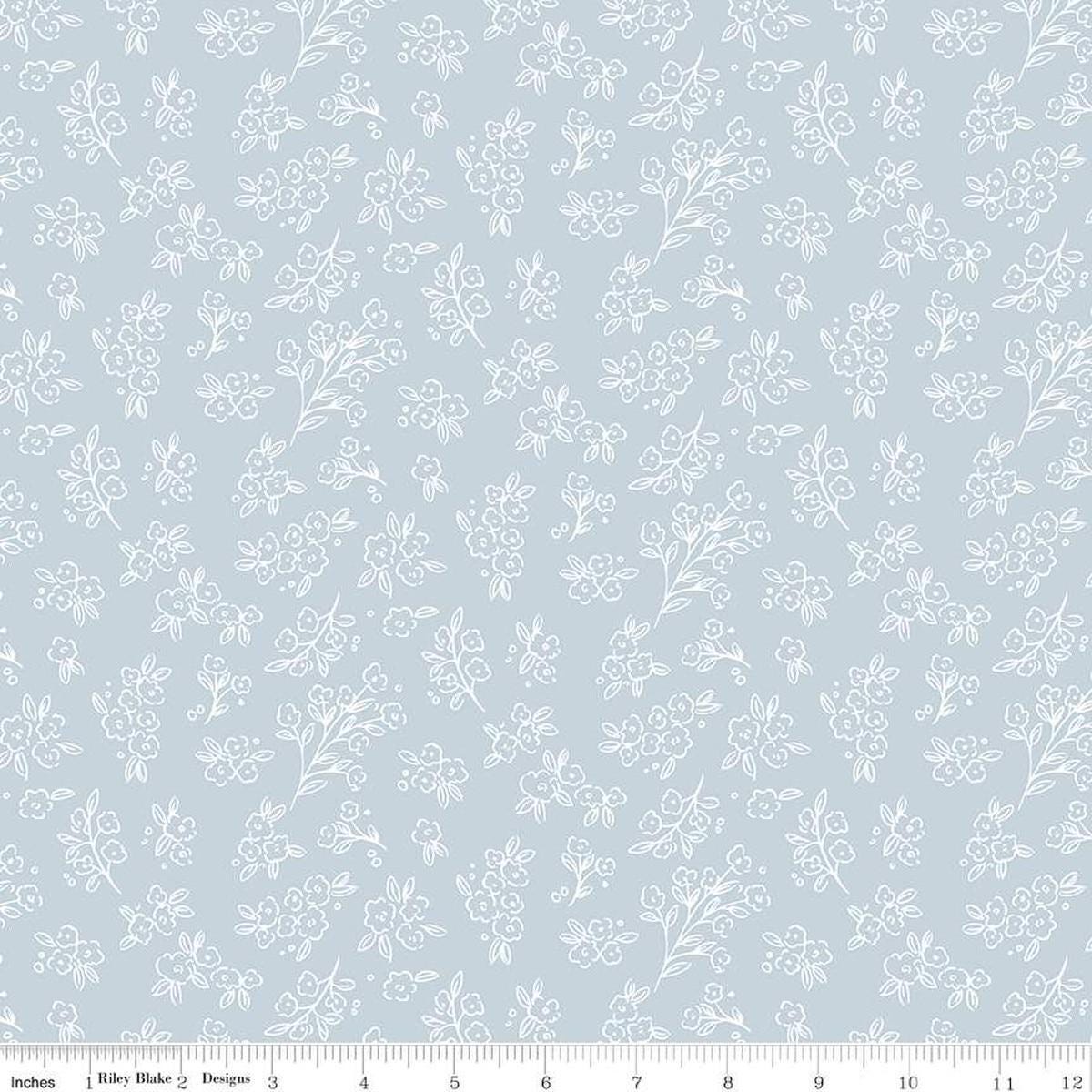 Image of the Floral Charms Posies Stone quilting cotton fabric by Kelsey Carlson for Riley Blake Designs. Features flowers on a blue background. Cute Little Fabric Shop