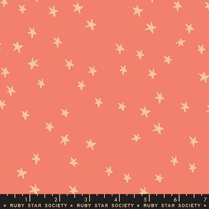 Image of the Starry Blenders Star Papaya quilting cotton fabric by Alexia Abegg for Moda Fabrics. Features small scattered stars on a coral background. Cute Little Fabric Shop