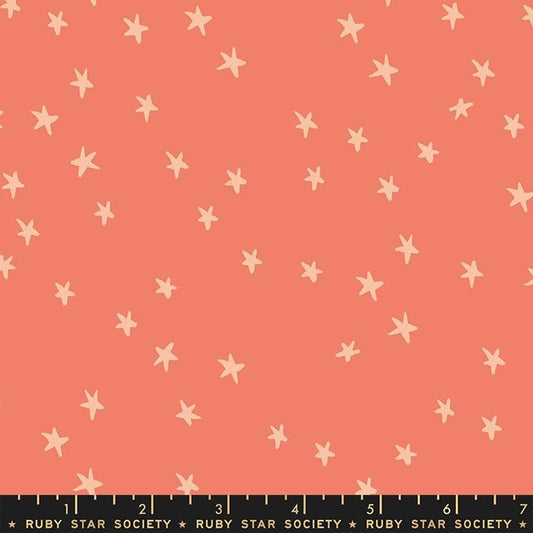 Image of the Starry Blenders Star Papaya quilting cotton fabric by Alexia Abegg for Moda Fabrics. Features small scattered stars on a coral background. Cute Little Fabric Shop
