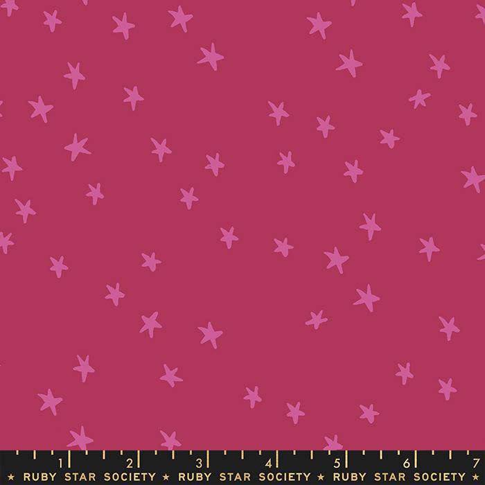 Image of the Starry Blenders Star Plum quilting cotton fabric by Alexia Abegg for Moda Fabrics. Features small scattered stars on a dark pink background. Cute Little Fabric Shop