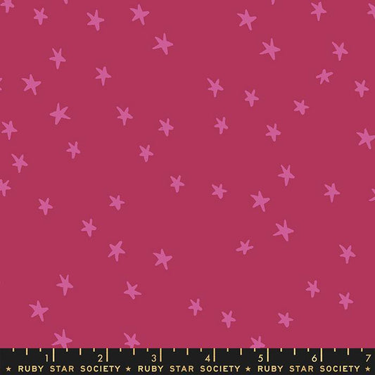 Image of the Starry Blenders Star Plum quilting cotton fabric by Alexia Abegg for Moda Fabrics. Features small scattered stars on a dark pink background. Cute Little Fabric Shop