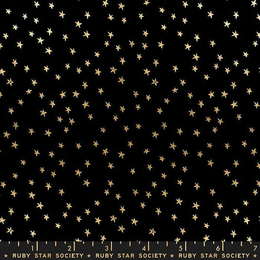 Image of the Starry Blenders Star Black Gold quilting cotton fabric by Alexia Abegg for Moda Fabrics. Features small scattered stars on a black background. Cute Little Fabric Shop