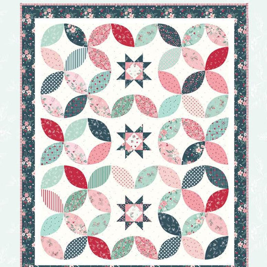Image of the Stacking Stars quilt pattern by Beverly McCullough for Riley Blake Designs. Features stars on a quilt. 
Cute Little Fabric Shop