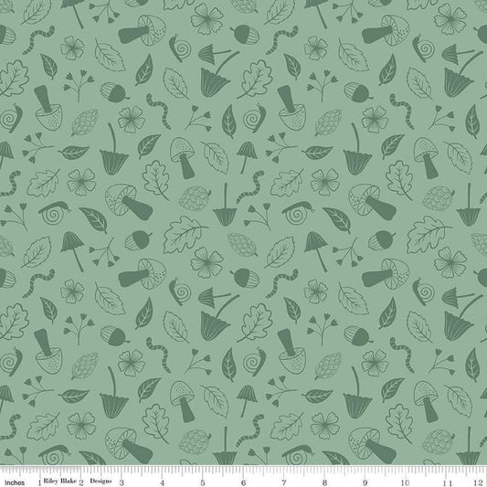 Image of the Forest Village Foraging Sage quilting cotton fabric by Little Forest Atelier for Riley Blake Designs. Features a mushrooms on a green background. Cute Little Fabric Shop