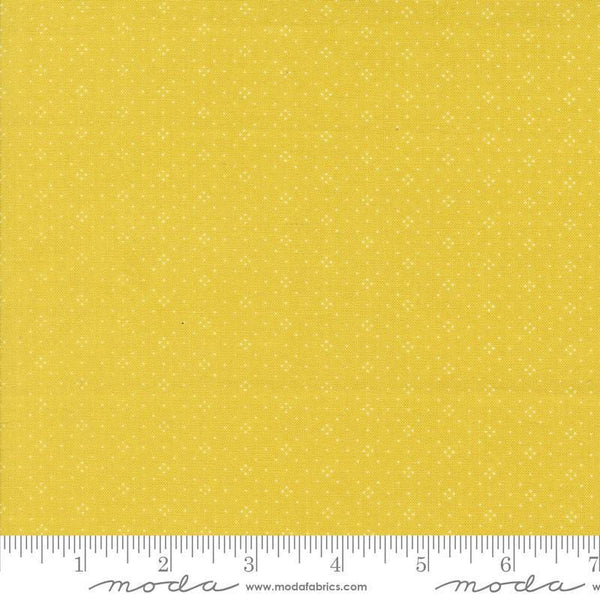 Image of the Portofino Eyelet Dots Citron quilting cotton fabric by Fig Tree Co for Riley Blake Designs. Features small circles on a yellow background. Cute Little Fabric Shop