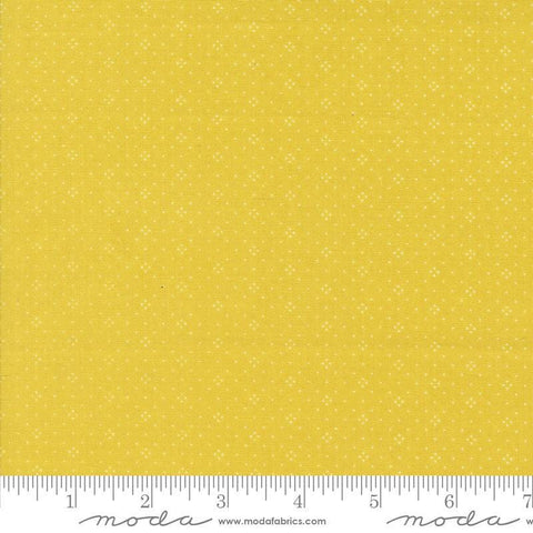 Image of the Portofino Eyelet Dots Citron quilting cotton fabric by Fig Tree Co for Riley Blake Designs. Features small circles on a yellow background. Cute Little Fabric Shop