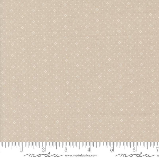 Image of the Portofino Eyelet Dots Cobblestones quilting cotton fabric by Fig Tree Co for Riley Blake Designs. Features small circles on a tan background. Cute Little Fabric Shop