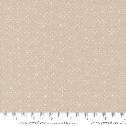 Image of the Portofino Eyelet Dots Cobblestones quilting cotton fabric by Fig Tree Co for Riley Blake Designs. Features small circles on a tan background. Cute Little Fabric Shop