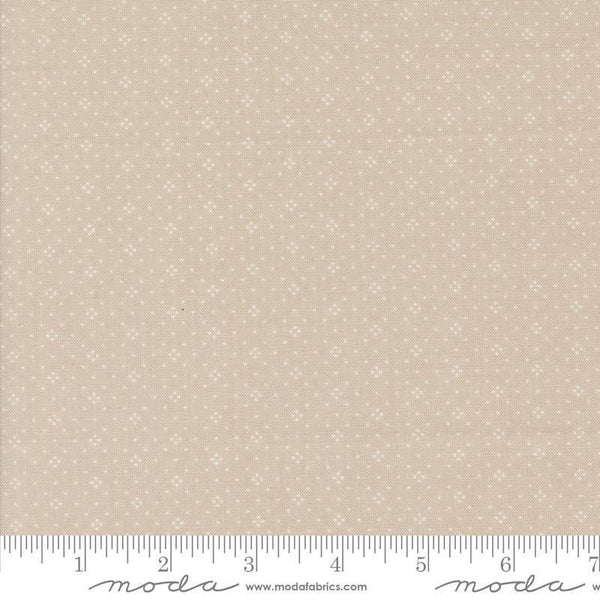 Image of the Portofino Eyelet Dots Cobblestones quilting cotton fabric by Fig Tree Co for Riley Blake Designs. Features small circles on a tan background. Cute Little Fabric Shop
