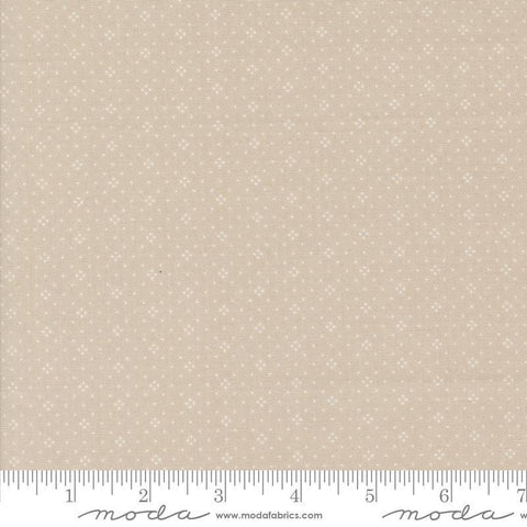 Image of the Portofino Eyelet Dots Cobblestones quilting cotton fabric by Fig Tree Co for Riley Blake Designs. Features small circles on a tan background. Cute Little Fabric Shop