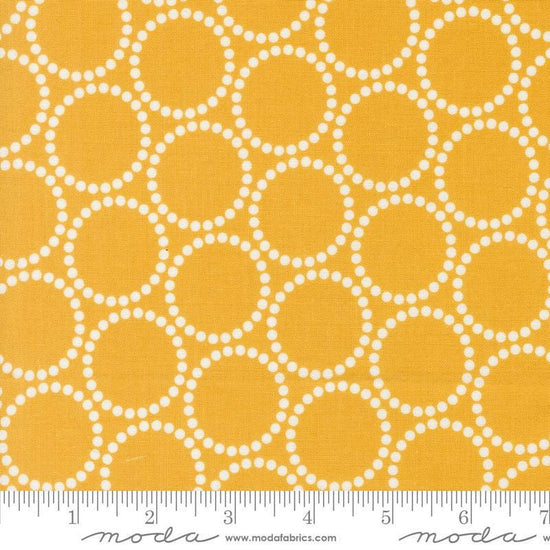 Image of the Love Letter Dots Golden quilting cotton fabric by Lizzy House for Moda Fabrics. Features dotted circles on a yellow background. Cure Little Fabric Shop