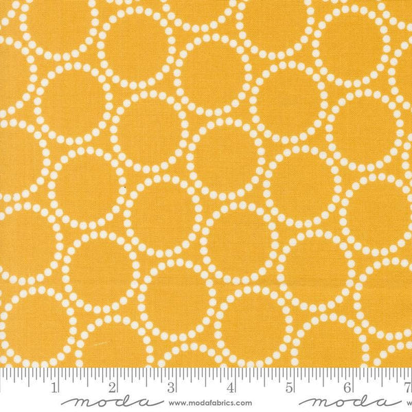 Image of the Love Letter Dots Golden quilting cotton fabric by Lizzy House for Moda Fabrics. Features dotted circles on a yellow background. Cure Little Fabric Shop