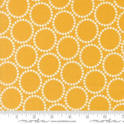 Image of the Love Letter Dots Golden quilting cotton fabric by Lizzy House for Moda Fabrics. Features dotted circles on a yellow background. Cure Little Fabric Shop